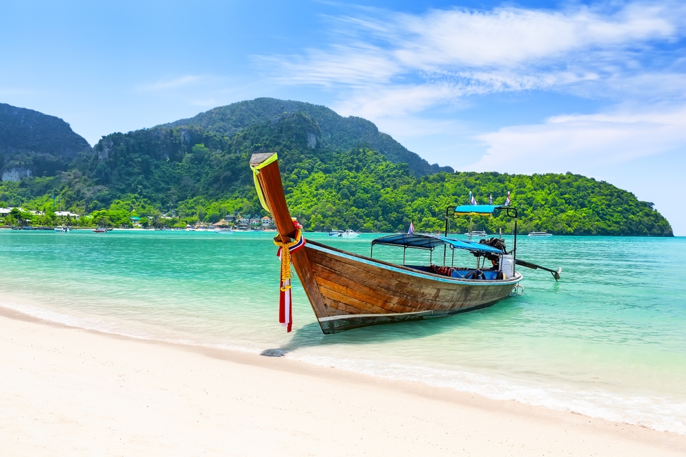 Long-tail boat on a tropical beach in Thailand